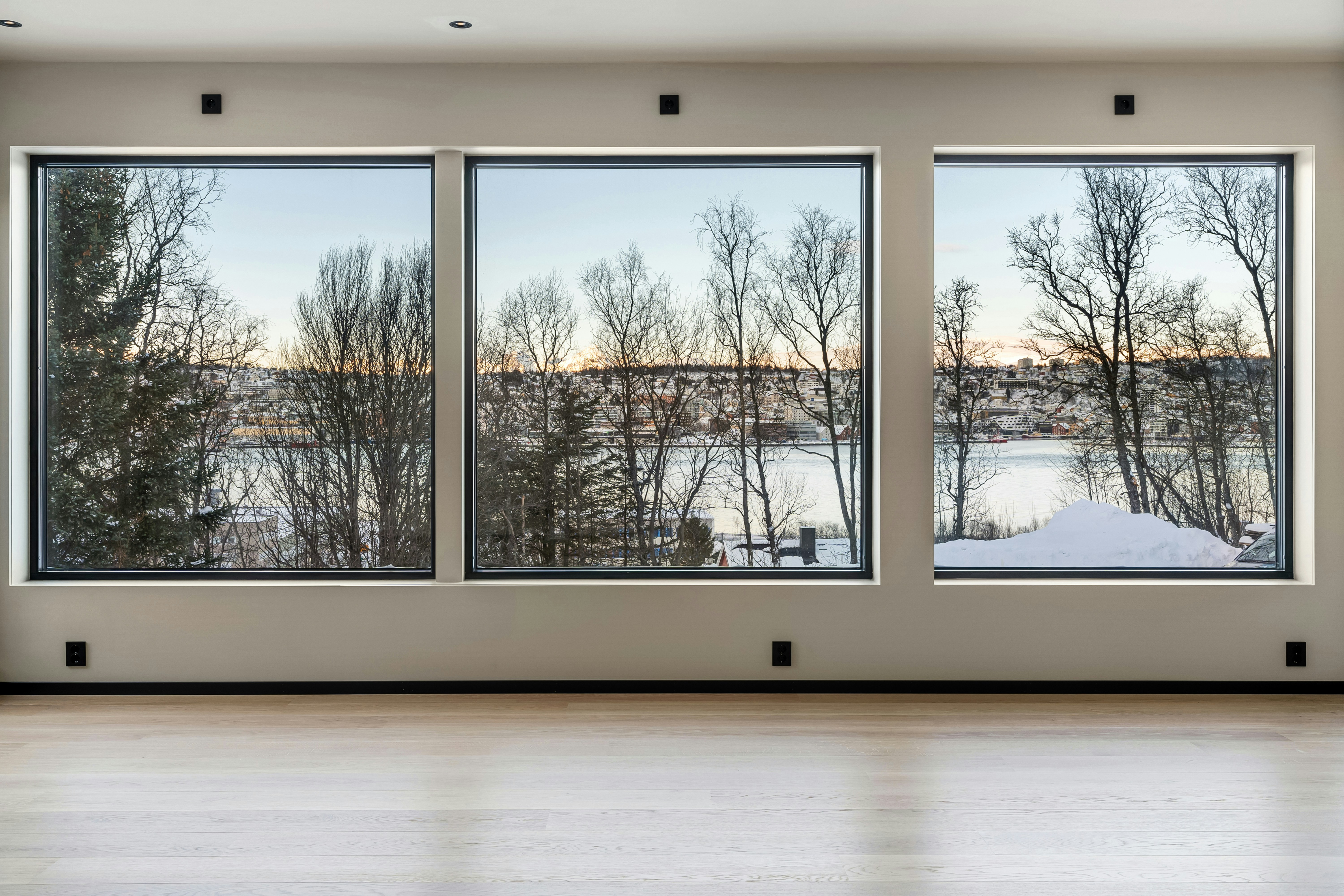 Modern interior with large windows overlooking a landscape